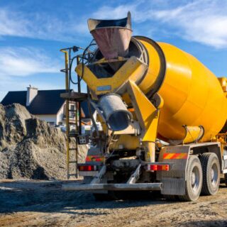 Yellow cement mixer on site