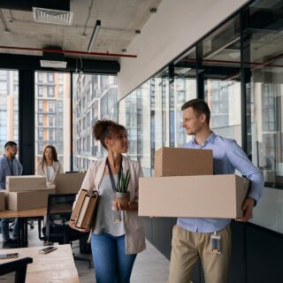 Young company employees preparing for office moving