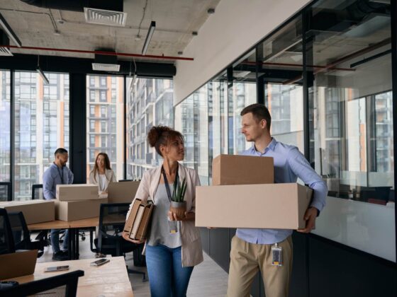 Young company employees preparing for office moving