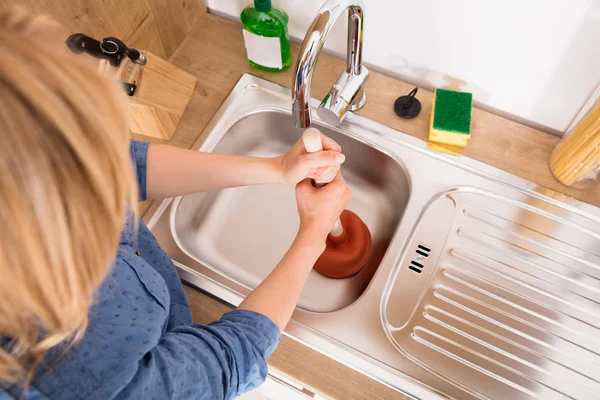 Women use Household Plunger