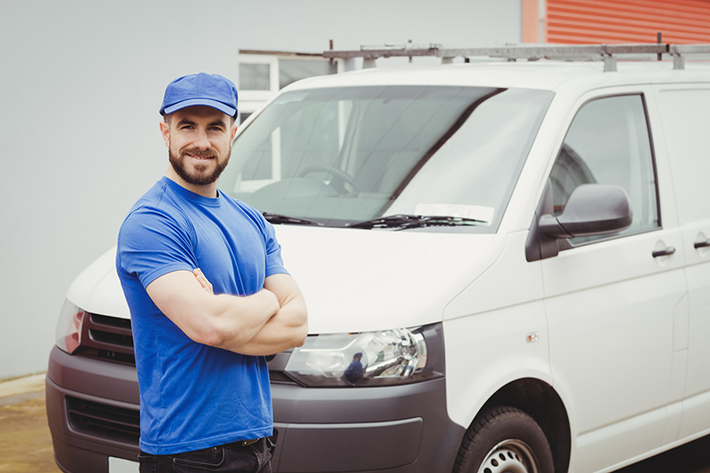 Man standing in front of van